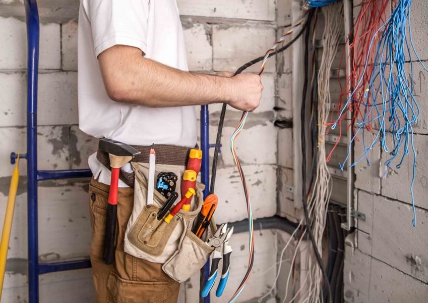 An electrician rewiring a commercial property